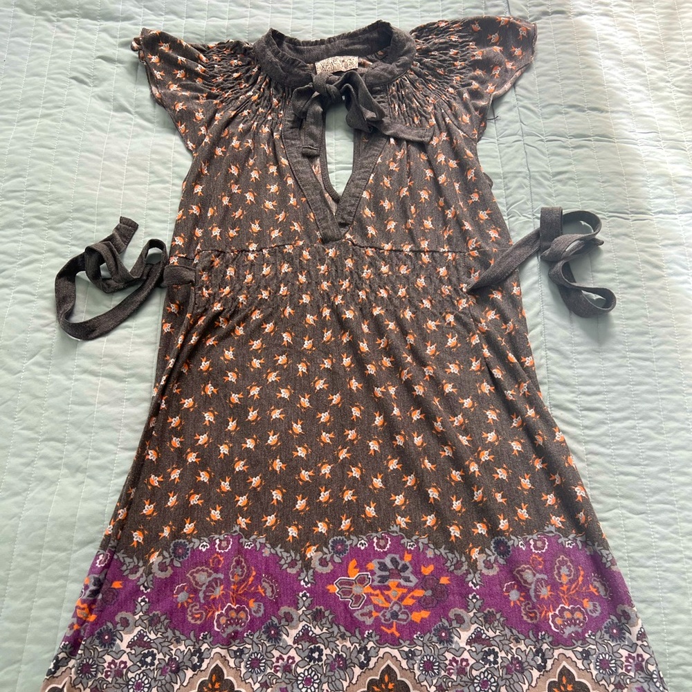 Cute mini dress with windows on the chest and the back